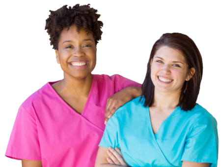 Two women in scrubs are smiling for the camera.